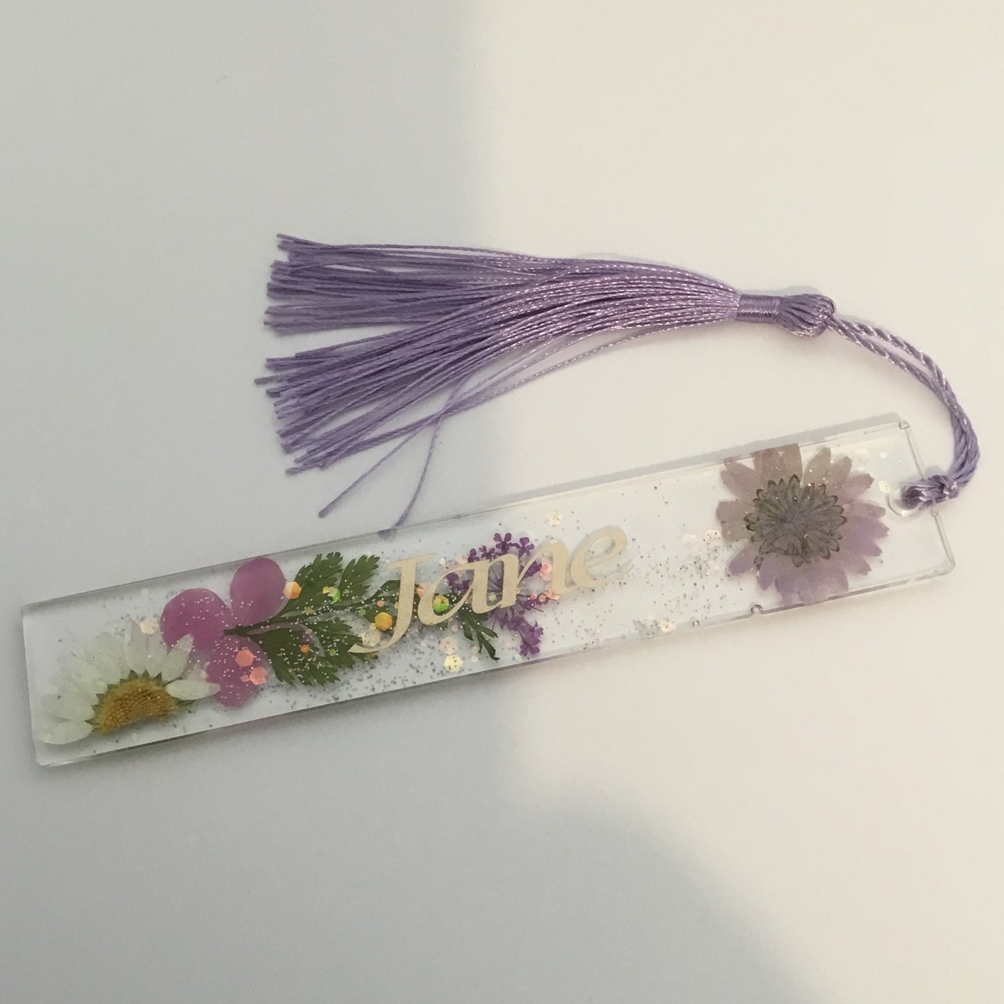 Lilac Floral Bookmark, handmade with dried flowers and gold leaf. Personalised with gold text